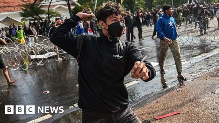 Three dead after protests over death of taxi driver in Indonesia Three dead after protests over death of taxi driver in Indonesia