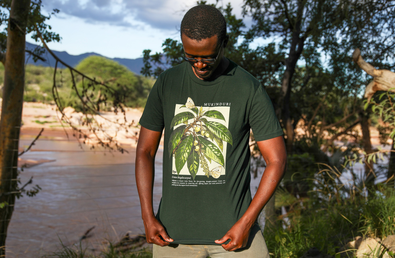 IFAW team member, Christopher Kiarie, wearing the Mukinduri T-shirt from the Plant Kween x IFAW Loita Forest collection.
