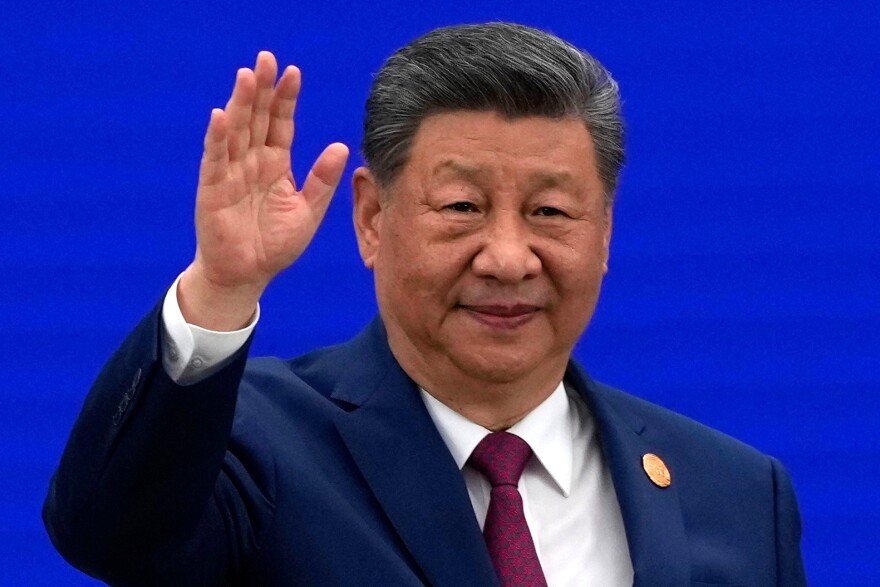 Chinese President Xi Jinping waves as he arrives at the opening ceremony for the World AI Conference in Shanghai, Friday, July 17, 2026.